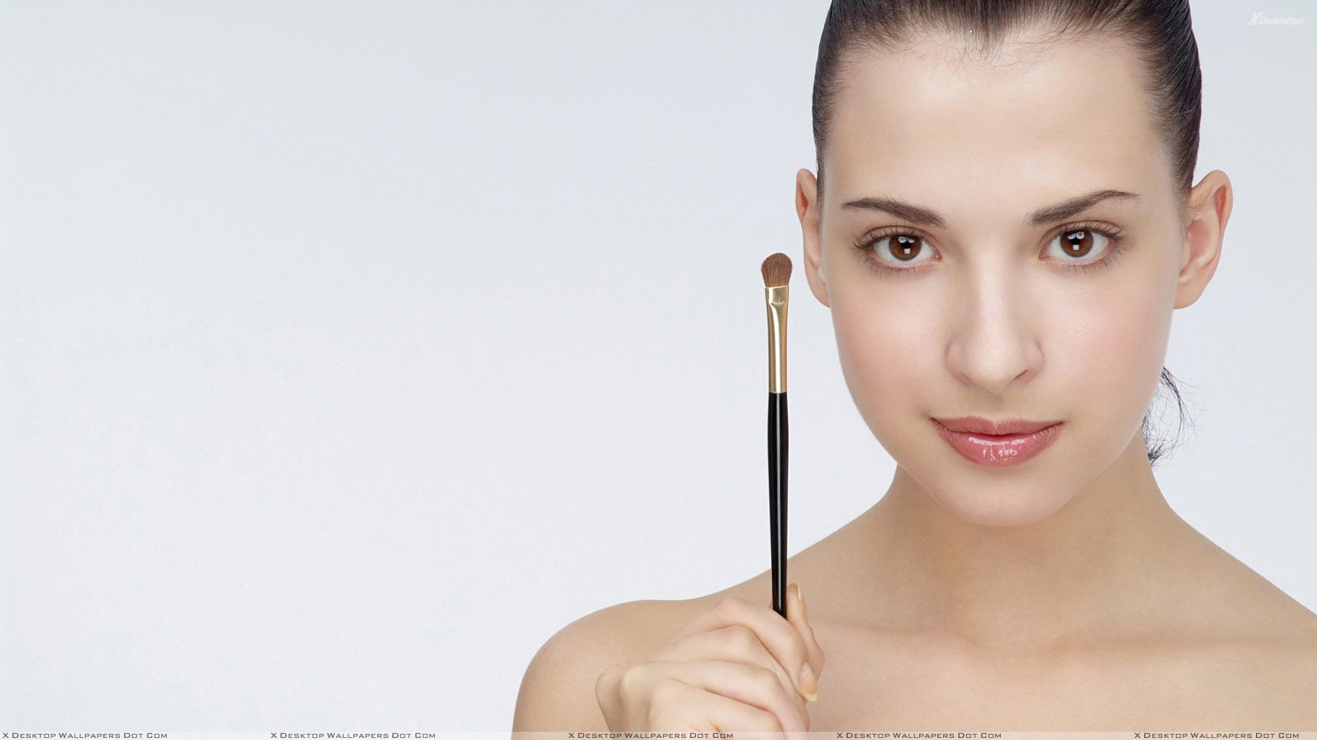 Girl Showing Makeup Face Brush Photoshoot